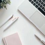 Minimalist Workspace with Laptop, Pens, and Notebook.